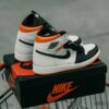 Pair of air jordan 1 sneakers and their box.
