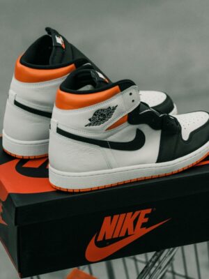 Pair of air jordan 1 sneakers and their box.